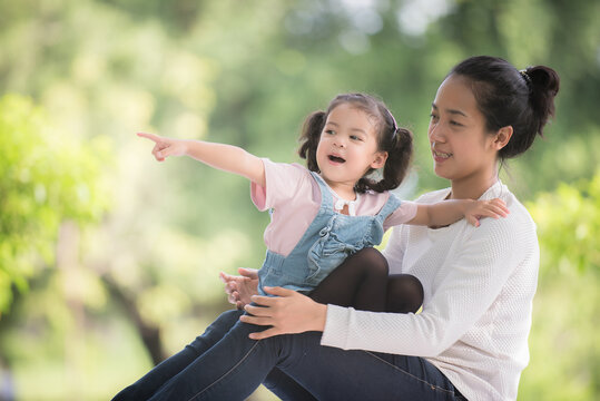Portrait girl child and mother woman