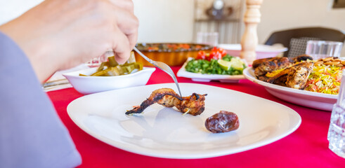 Arabic muslim woman enjoying food at iftar in ramdan