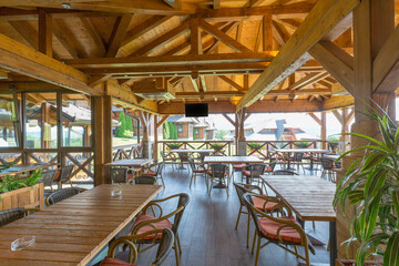 Interior of a hotel restaurant with wooden furniture