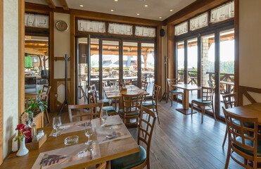 Interior of a hotel restaurant with wooden furniture