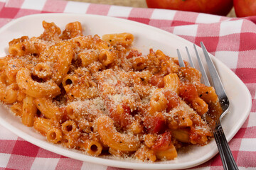 Delicious meal of elbow macaroni with pasta sauce and parmesan