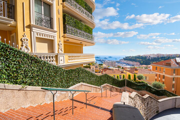 A long, winding staircase connecting different levels of homes and apartments on the steep hillside...