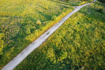 Aerial landscape - road between summer fields