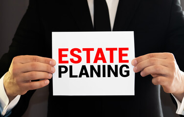 Work smarter text Estate Planing on white sheet with pen, calculator and tables