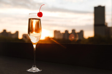 champagne at the rooftop at sunset time