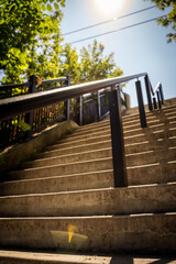Fototapeta premium Looking up the stairs with sunbam