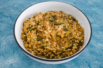plant-based food, vegan rice and toasted farro with turmeric and vegetables