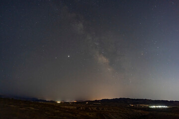 Obraz na płótnie Canvas Night starry sky with a beautiful milk way over Lake Mead