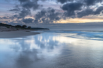 Sunrise Seascape with Clouds and Ships on the Horizon