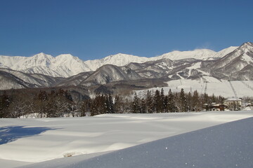 Daytime shot of snowed mountains in northern alps of Japan, Hakuba