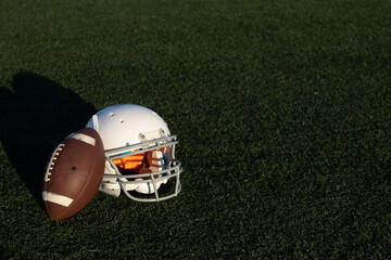 american football helmet on grass, negative space