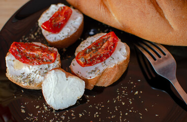 sandwiches with curd cheese and dried tomatoes. food breakfast on a plate