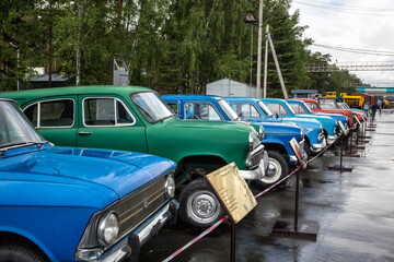 Old Soviet cars in the parking lot.