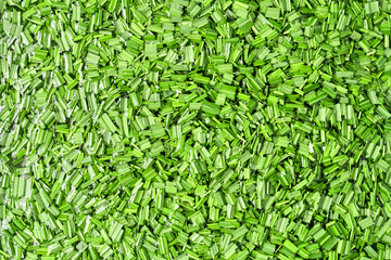 Green fresh grass floats in water after rains and floods.