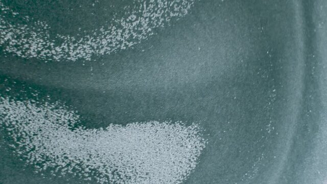 Aluminum powder paint pigment particle convection movement in solvent acetone simulating Suns surface granules