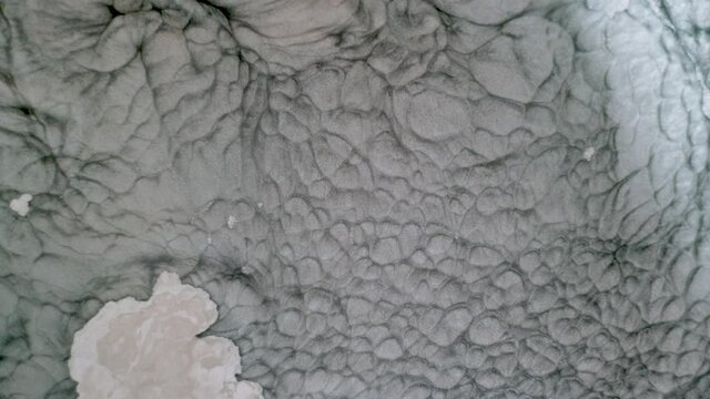 Aluminum powder paint pigment particle convection movement in solvent acetone simulating Suns surface granules