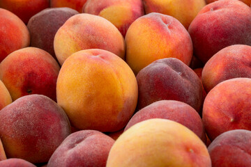 Background and texture of ripe peaches. Close-up.