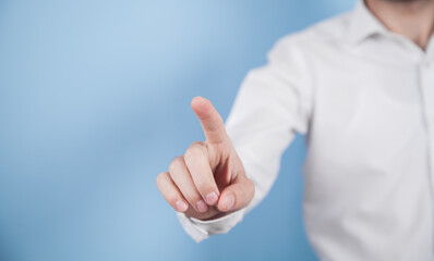 Man pointing or touching finger in screen.
