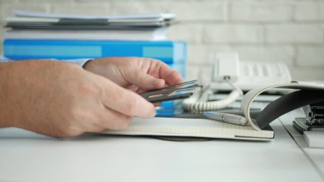 Businessman at Office Works with Floppy Disks, Old Magnetic Storage Disks Used for Computers, Outdated Technology