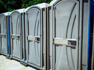 Row of portable toilets in the park