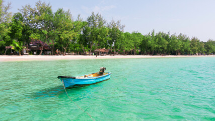 Fototapeta na wymiar A small boat at the beach of Koh Rong Island, Cambodia