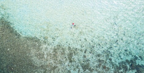 Aerial view. Beautiful paradise island RAWA. Prisitine water and corals