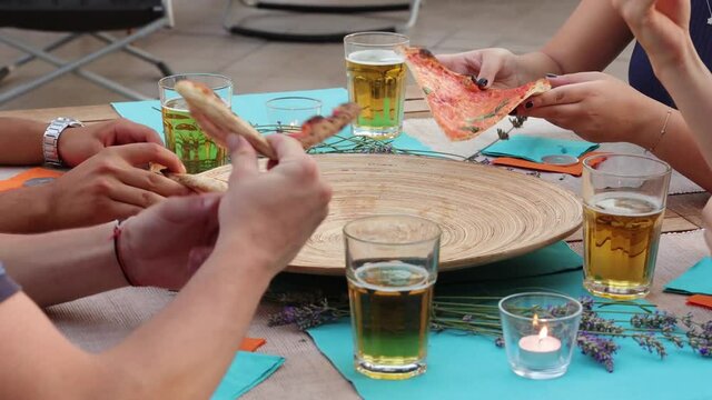 group of kids eating Italian pizza from the same dish