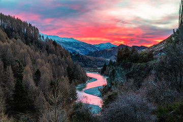 burning red sunrise  over the shot over river in Queenstown South Island in New Zealand 