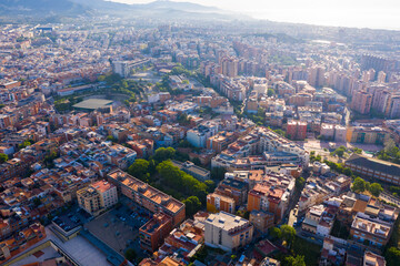Aerial view of Santa Coloma de Gramenet with a apartment buildings and Besos river, Spain