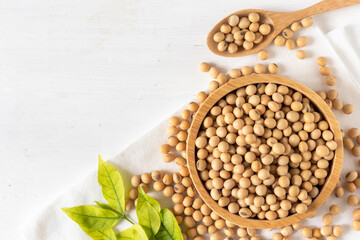 top view of soybean or soya bean in a bowl on white wooden background