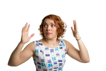 Portrait of a young redheaded overweight girl on a white background isolated