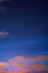 Naklejka na ściany i meble Neowise Comet ( C/2020 F3 )in cloudy night sky at , grain image