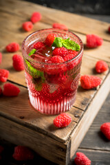 Old fashioned raspberry cocktail. Selective focus. Shallow depth of field.