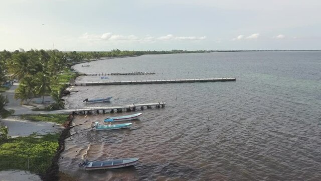 Drone Aerial Fly Over Footage overlooking panga dock at Punta Allen, Mexico