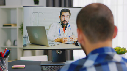 Fototapeta na wymiar Patient on video call with doctor talking about his rehabilitation.