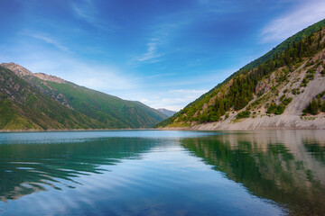 Fototapeta na wymiar Beautiful mountain turquoise color lake Karasuu. Kyrgyzstan.