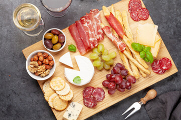 Cheese, meat, grapes and olives antipasto