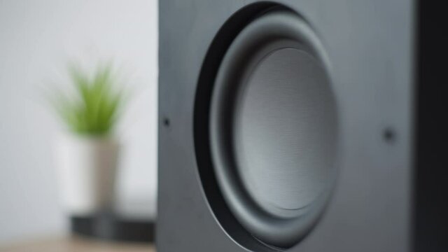 An Ikea Bluetooth speaker's subwoofer playing loud music. 4K