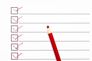 Checklist and red pencil closeup
