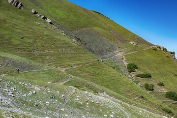 Idyllic summer landscape with hiking trail in the mountains with beautiful fresh green mountain...
