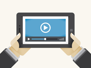 Video movie player on tablet computer in holding human hands. Concepts: streaming technologies, services (Youtube, Netflix), home films media collection, video sharing (Instagram, Facebook), online TV