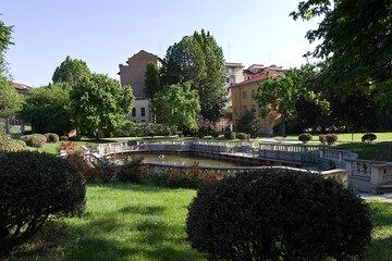 Milan - Guastalla Garden historic garden, the baroque fishpond enclosed by an elegant granite balustrade. Lombardy
