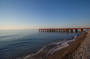 Seascape view with pier in the early morning