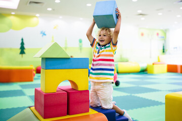 Kids play. Construction toy blocks. Child toys