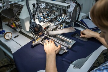 ULYANOVSK, RUSSIA - DECEMBER 3, 2018: Operator orks on control panel of modern and automatic high...