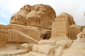 Block tombs in ancient Petra city in Jordan. This buildings are carved out of sandstone right into the rock. Theme of travel in Jordan.	
