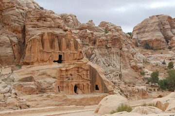 Obelisk tomb in ancient Petra city in Jordan. The building is carved out of sandstone right into...