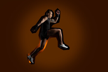 Fototapeta na wymiar Determined male athlete running on dark orange background