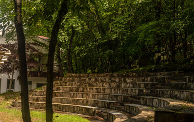Rock and stone stadium seating under shade trees