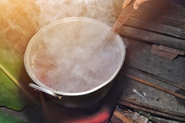 Rural kitchen using wood fuel for cooking. Traditional way of making food in Indonesia